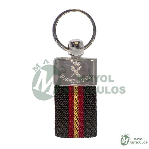 Llavero  Emblema grabado en metal  y material textil color marrón  con bandera